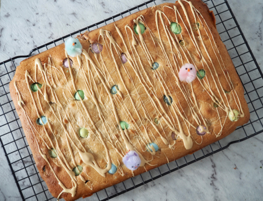 looking down at easter caramilk blondies on cooling rack uncut and out of the oven