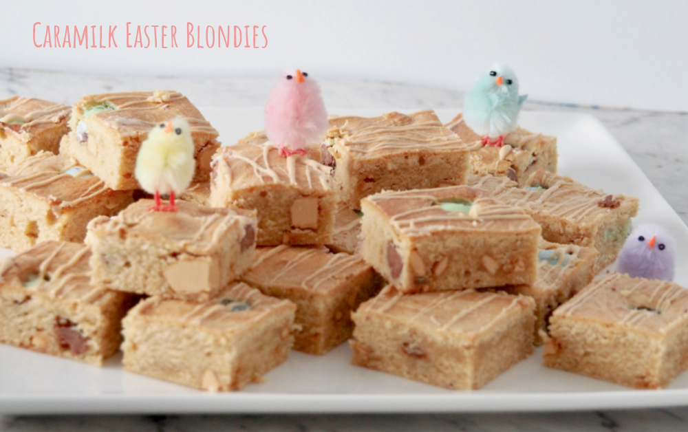 plate of caramilk blondie squares topped with fluffy decorative chicks