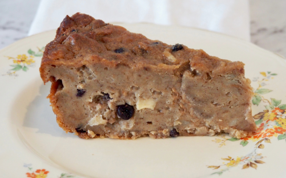 slice of apple and cinnamon hot cross bun pudding