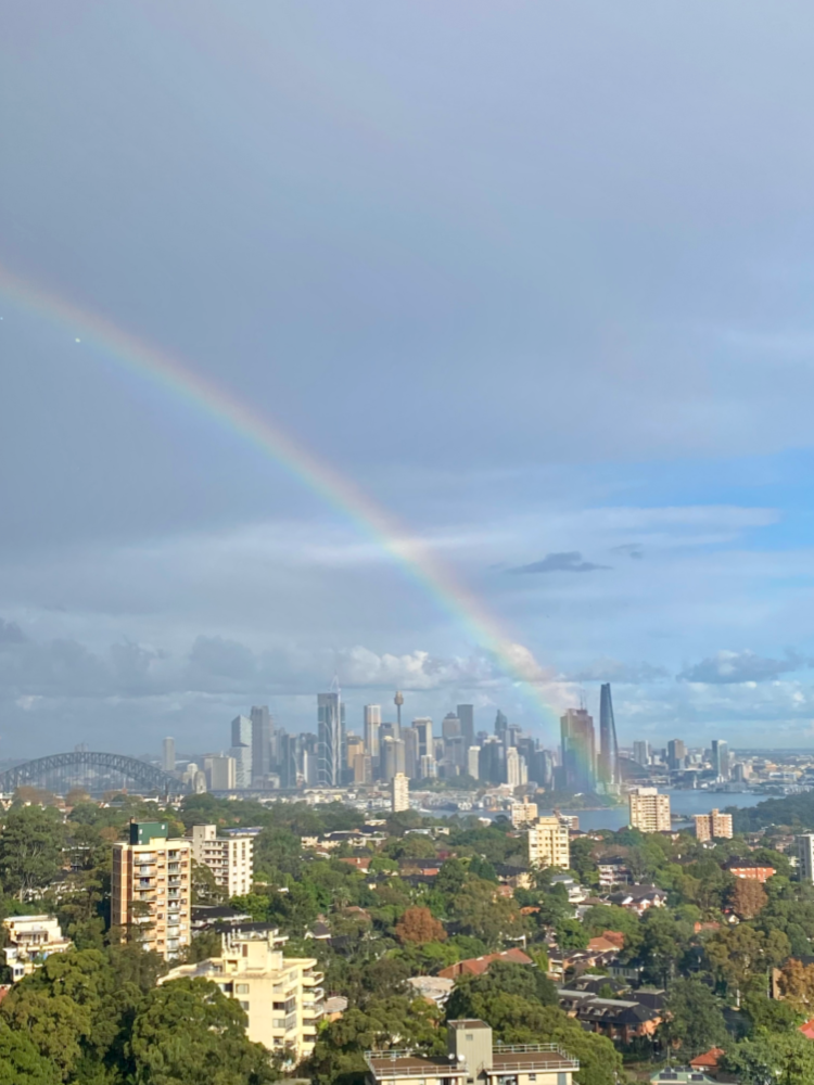 rainbow over the  sydney skyline