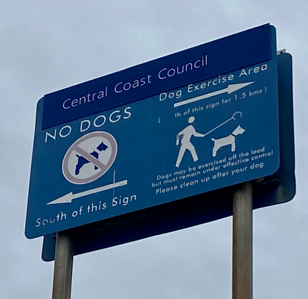 sign showing which part of beach is for off leash dogs