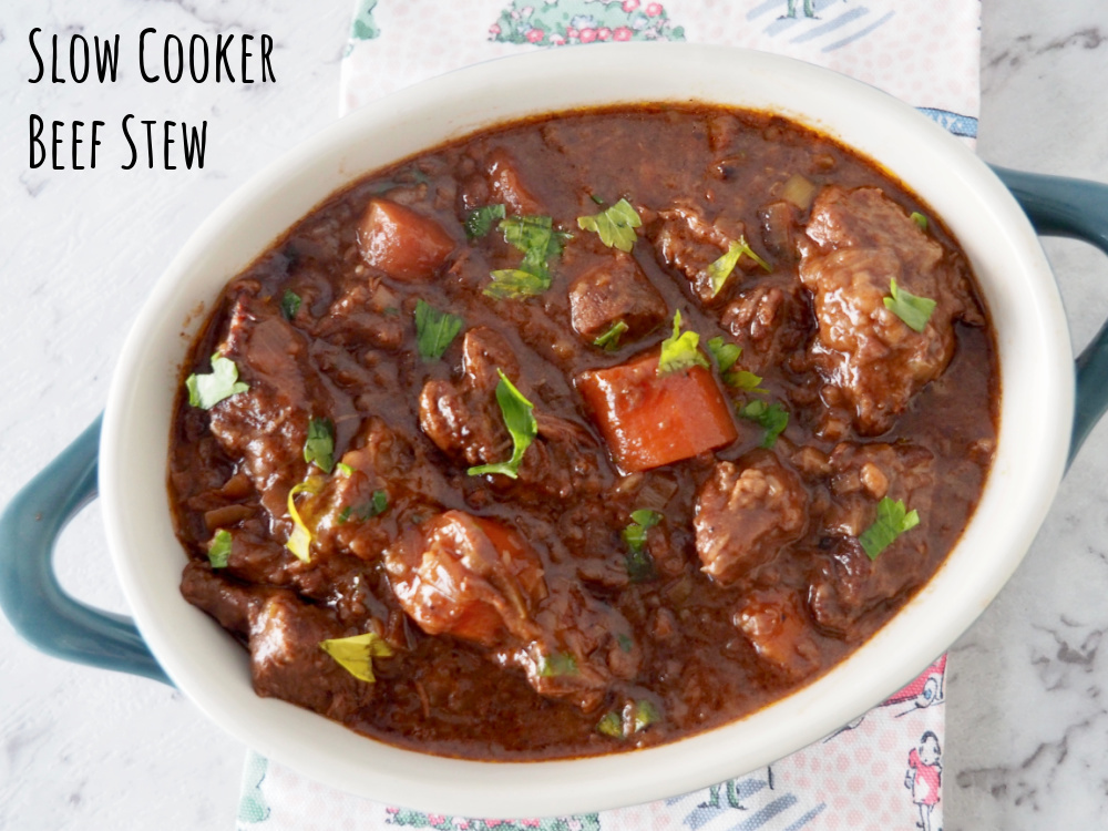 looking down on oval shaped casserole pot of beef stew