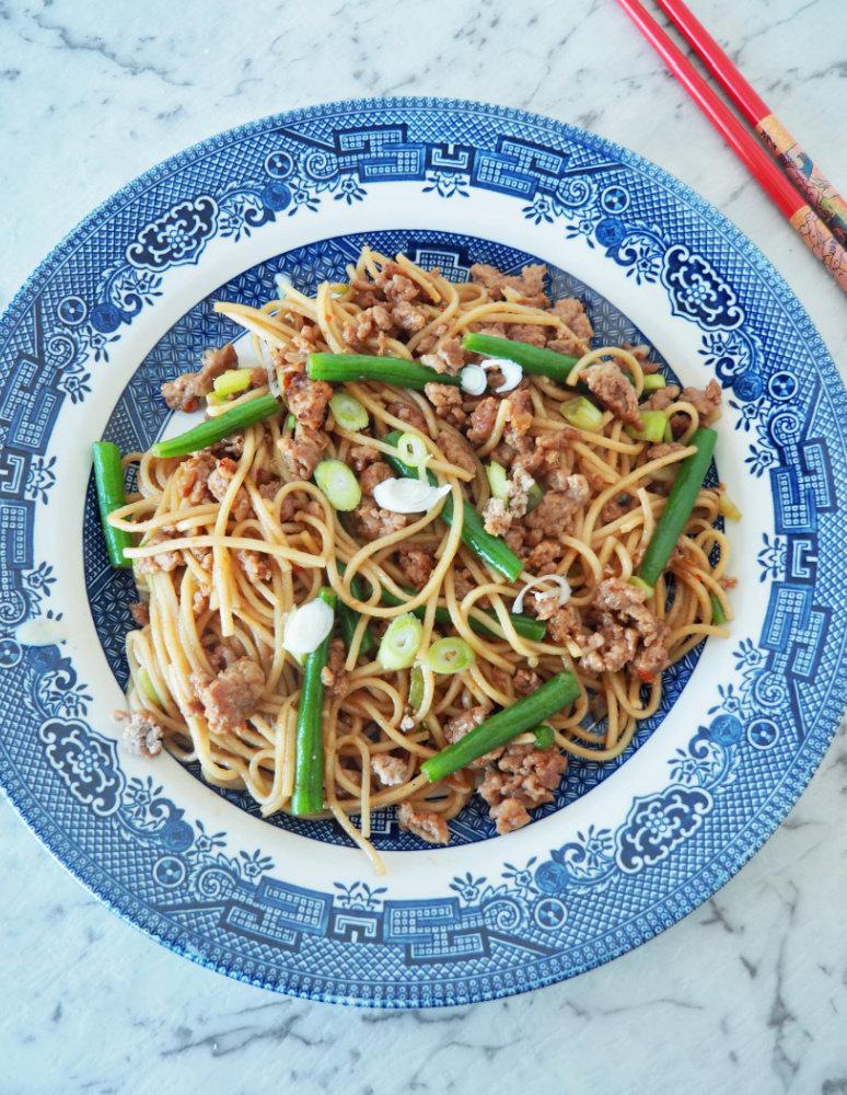 hoisin turkey noodles on blue willow pattern plate 