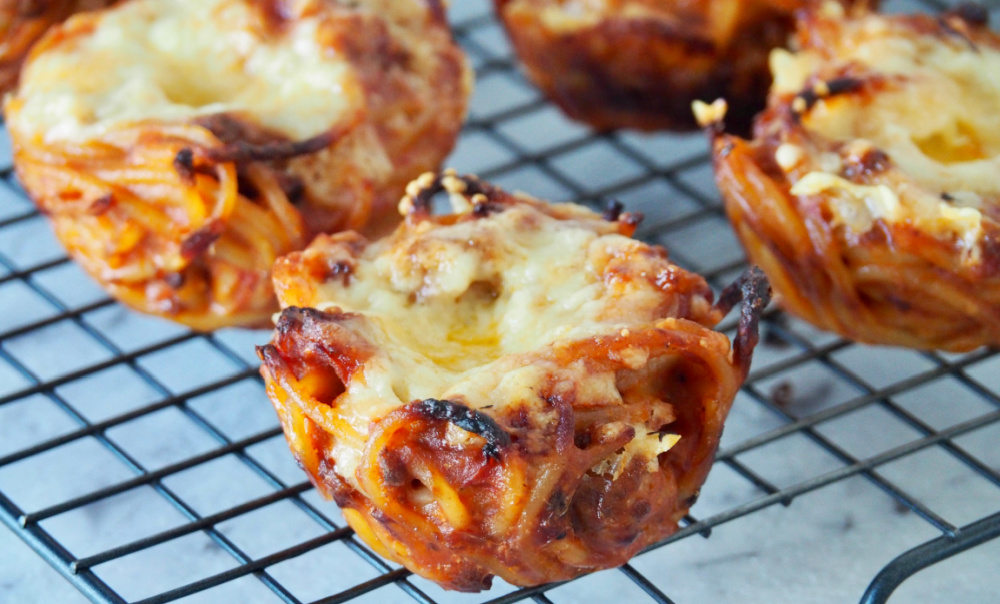 close up of spaghetti bolognese muffin on cooling rack