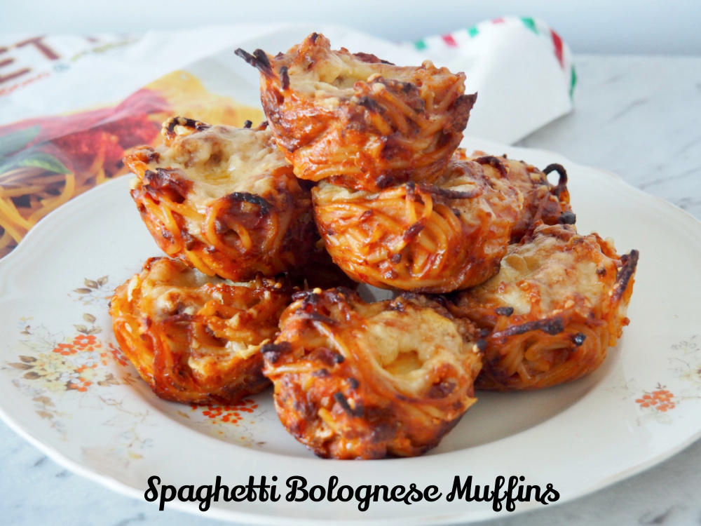 a plate of spaghetti bolognese muffins on a cream vintage flowery plate