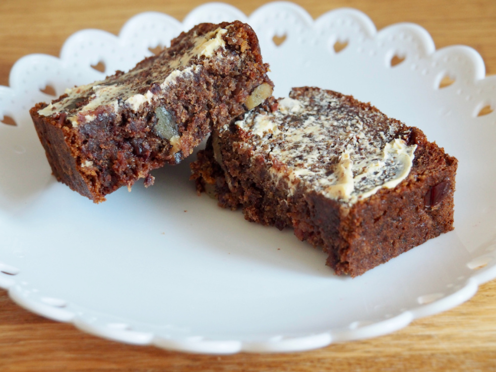 slice of persimmon cranberry and walnut loaf with butter