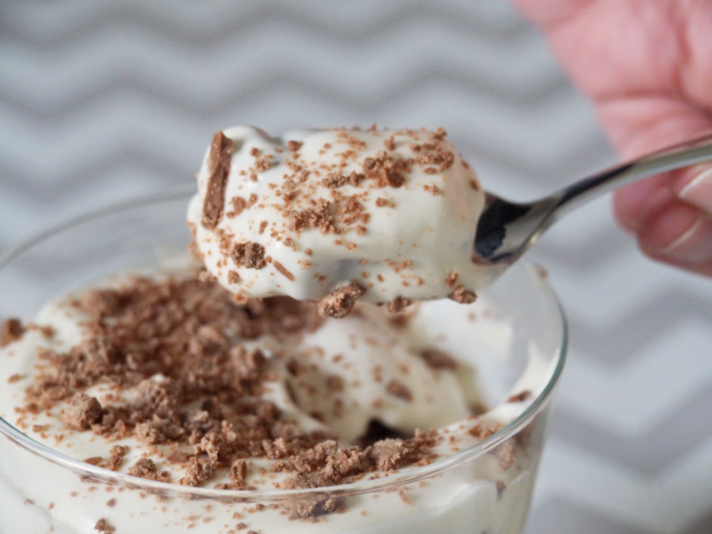 spoon dipped in dish of cheat's tiramisu