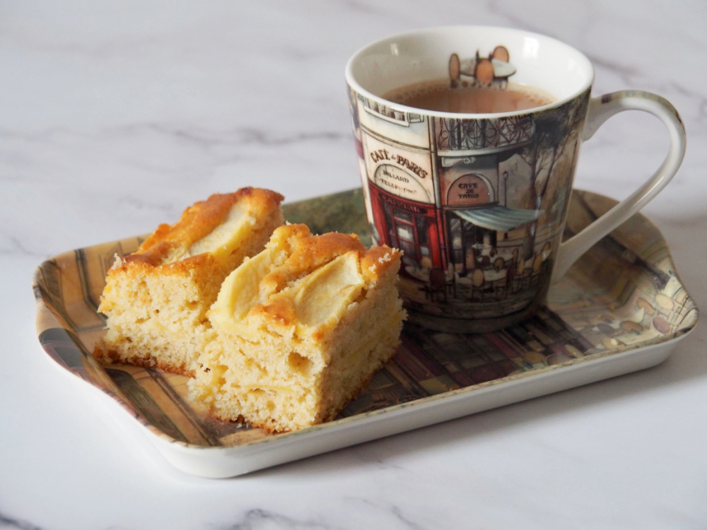 cup of tea and two squares of apple traybake
