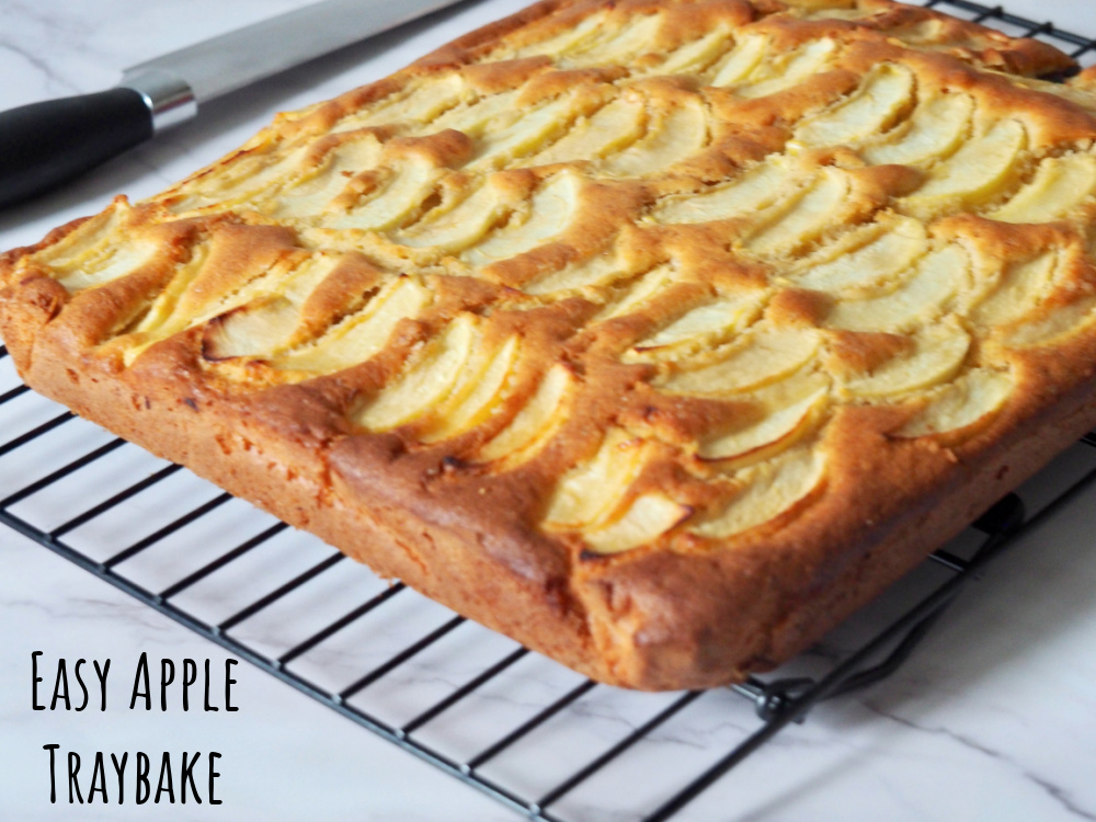 apple traybake on cooling rack with a large knife on the left hand side