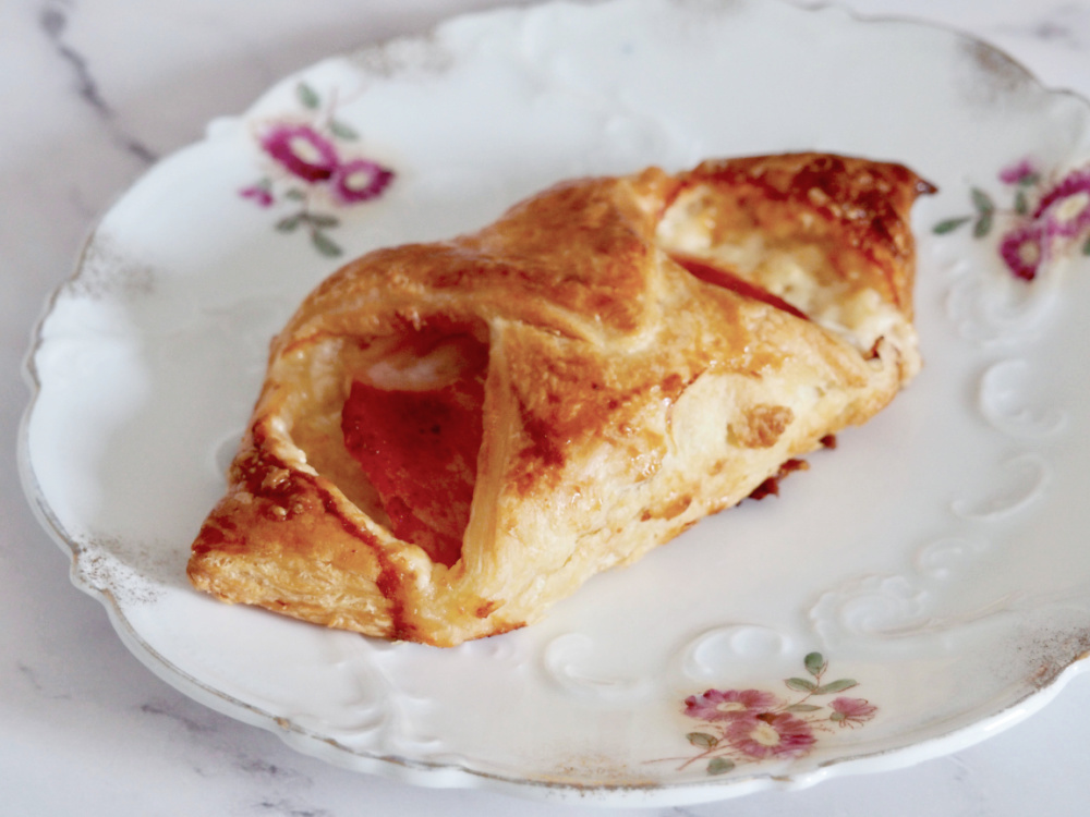 cheesy turnover on a vintage plate