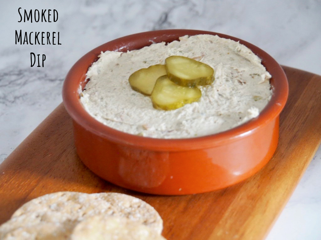 small terracotta dish of smoked mackerel pate on a small wooden serving board