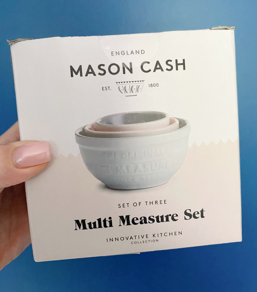 hand holding a box of mason cash measuring bowls