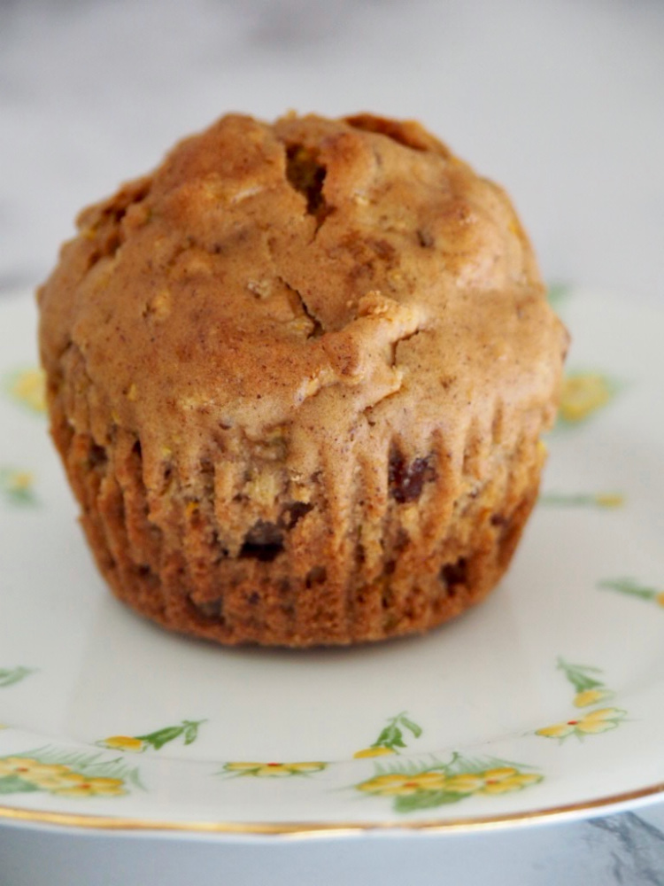 single courgette cupcake on a small yellow plate with yellow flowers