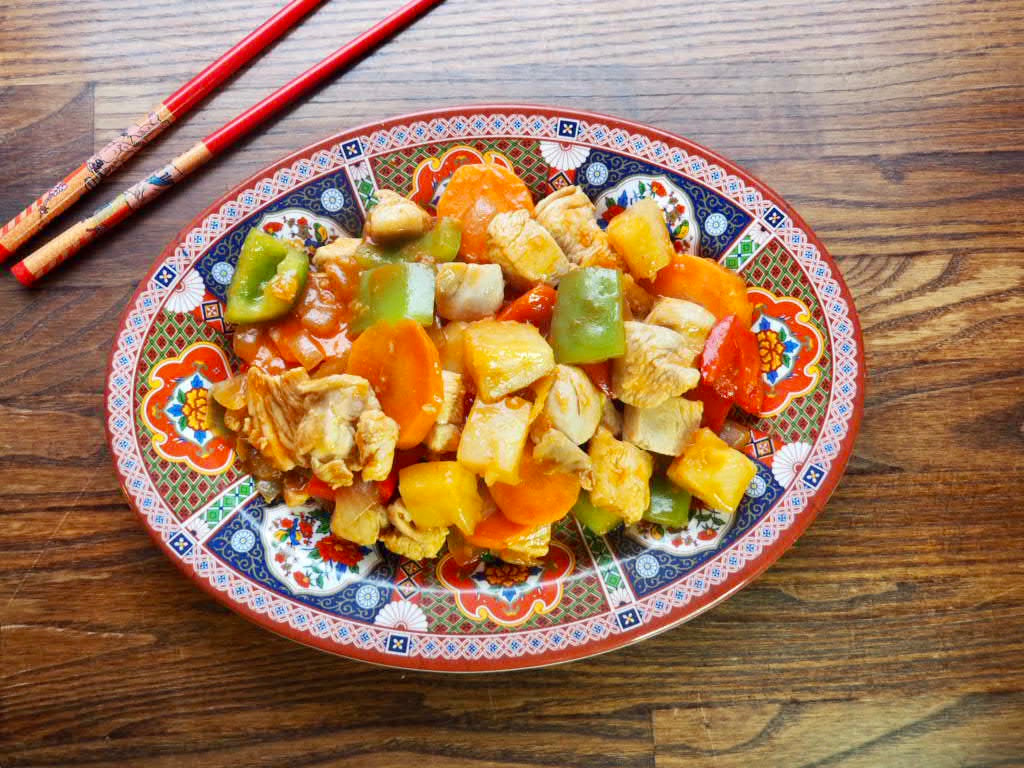 plate of sweet and sour chicken stir fry